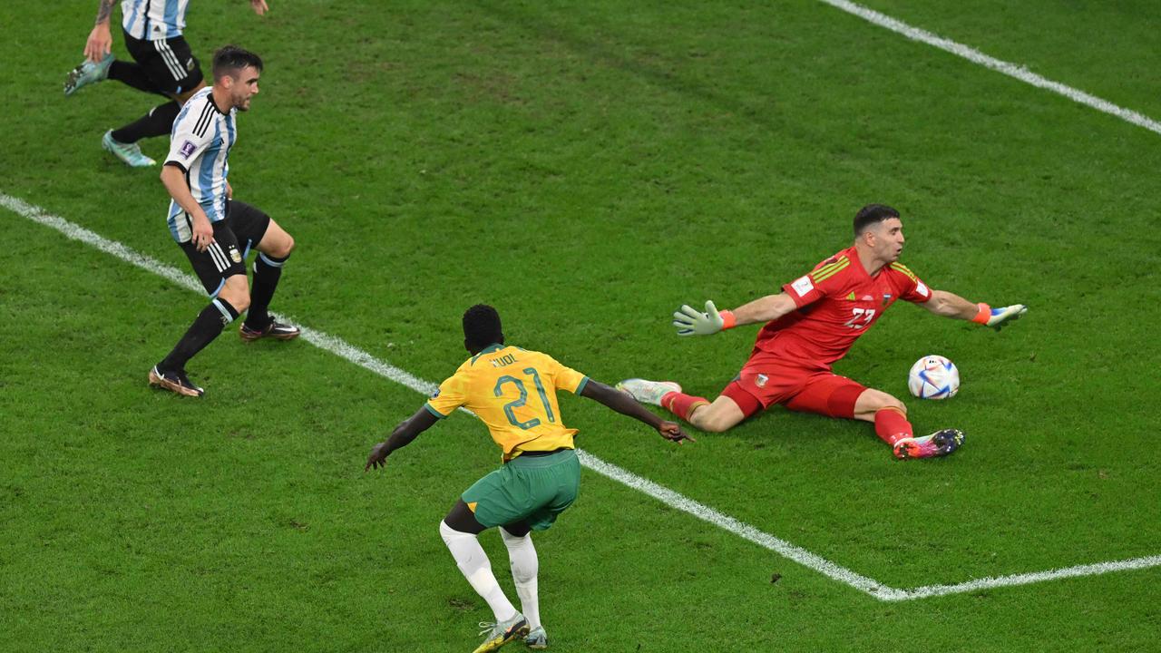 TOPSHOT - Argentina's goalkeeper #23 Emiliano Martinez saves a shot by Australia's forward #21 Garang Kuol.