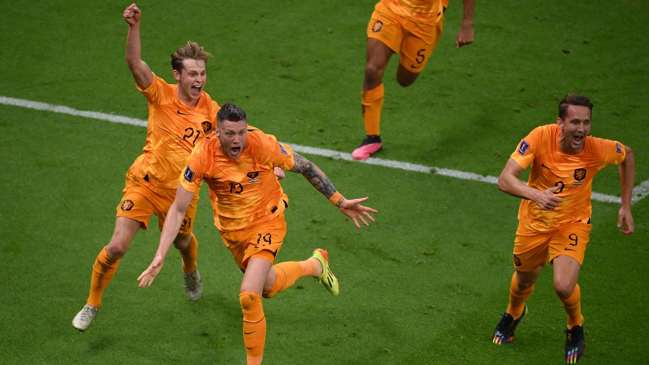 Wout Weghorst (front) celebrates after he scored at the Qatar 2022 World Cup. (Photo by FRANCK FIFE / AFP)