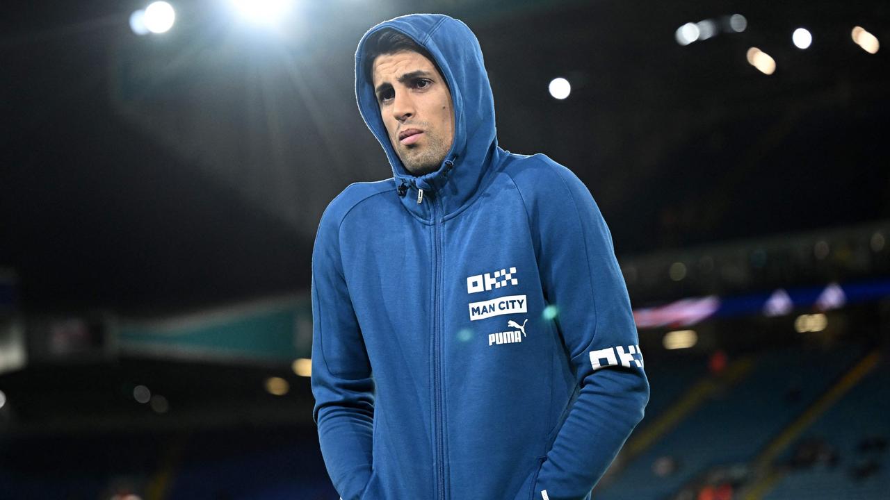 Cancelo has been cast to the bench since returning from the World Cup. (Photo by Oli SCARFF / AFP)