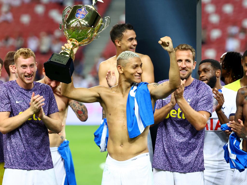 SINGAPORE, SINGAPORE - JULY 26: Richarlison #9 of Tottenham Hotspur lifts the Tiger Cup as he celebrates with teammates after the 5-1 win over the Lion City Sailors during a pre-season friendly at the National Stadium on July 26, 2023 in Singapore. (Photo by Yong Teck Lim/Getty Images)